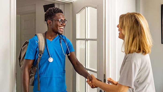 A male phlebotomist with a patient A male phlebotomist with a patient